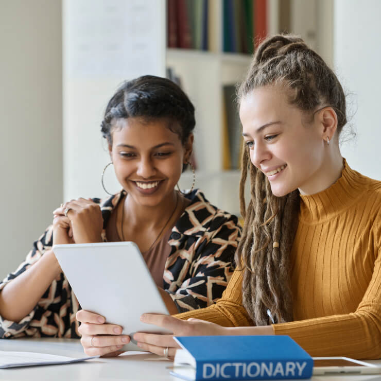 Two women using tablet